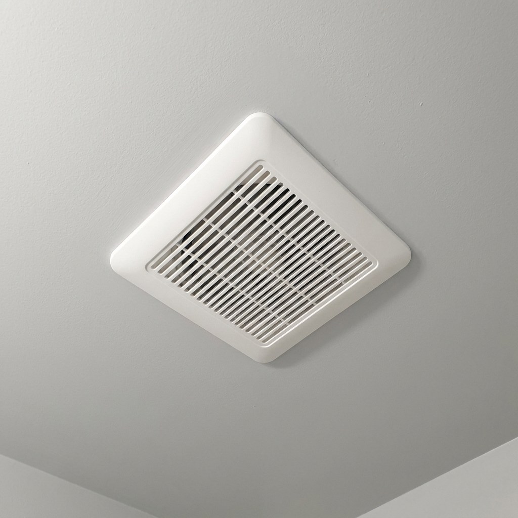Bathroom exhaust fan cover reattached