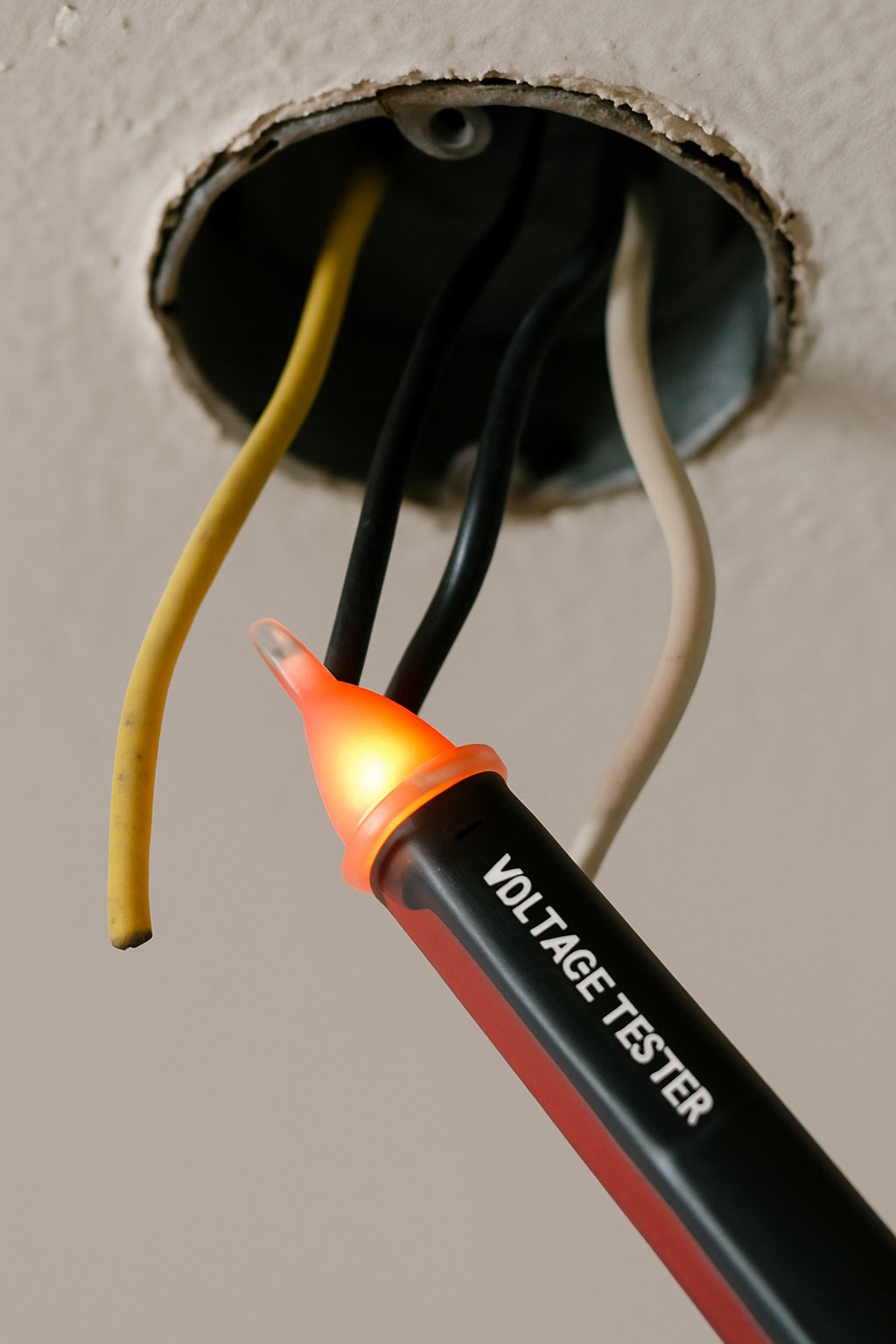 Voltage tester used on ceiling wires